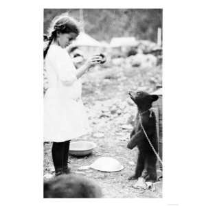 Girl Feeding Bear Cub in Seward, Alaska Photograph   Seward, AK 