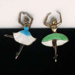 . Each is in mid dance pose. Both pins are marked sterling; the 