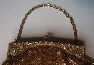 The handbag is missing one small rhinestone at one corner otherwise it 