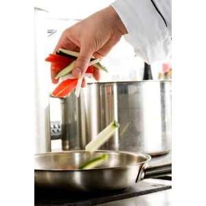  Chef Hands Add Vegetables on a Frying Pan on Pro kitchen 
