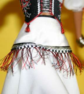  underskirt can be worn alone or with a removable beaded fringe belt