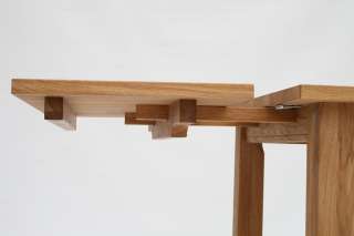 The table top is 25mm thick solid European oak and the legs are 70mm 