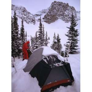  A Camper and His Tent in a Snowy Mountain Landscape 