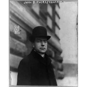 Photo John Davison Rockefeller, standing, half length portrait, facing 