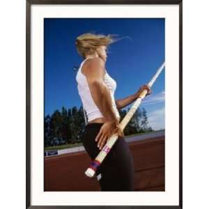  Low Angle View of a Female Athlete Pole Vaulting 